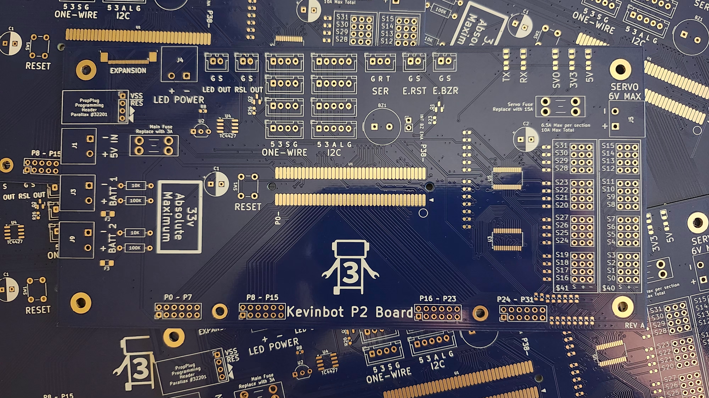 Image of blank, manufactured PCBs from PCBWay, blue; scattered